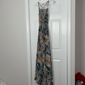 Floor length floral dress. Criss cross, strappy back, with zipper and tie.